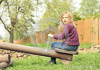 Little girl on a swing Stock Photo