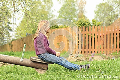 Little girl on a swing Stock Photo