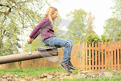 Little girl on a swing Stock Photo