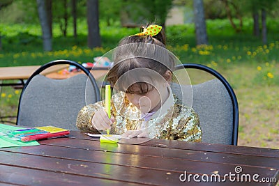 Little girl at the table Stock Photo