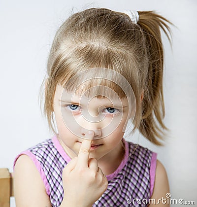 Little girl touching her nose Stock Photo