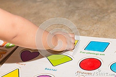 Little girl with toy numbers educational games at home, Board games for children modern learning,Girl learning counting number toy Stock Photo