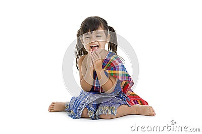 Little girl in traditional thai laughing Stock Photo