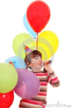 Little girl with trumpet and balloons birthday Stock Photo