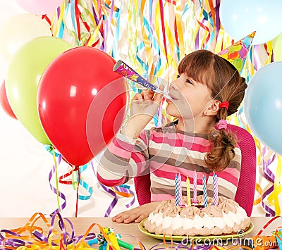 Little girl with trumpet and birthday cake Stock Photo