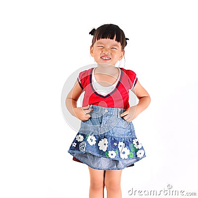 Little girl try skirt Stock Photo