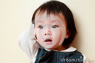 Little girl with unexpected look Stock Photo