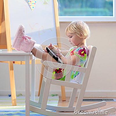 Little girl using tablet pc Stock Photo