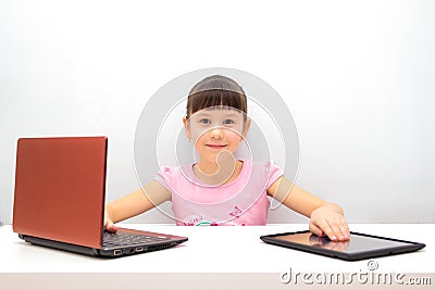 Little girl using a tablet pc Stock Photo