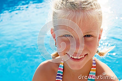 little girl vacationers beside swimming pool in a Stock Photo