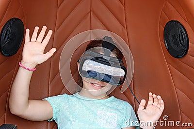 Little girl with virtual reality headset play video game Stock Photo