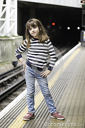 Little girl waiting the train Stock Photo