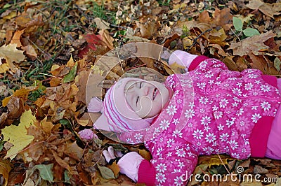 Little girl walks in autumn Stock Photo