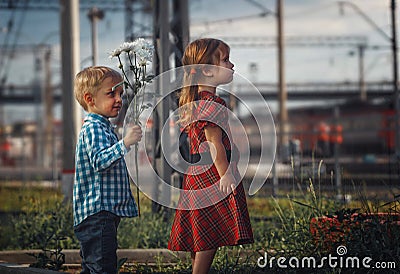 The little girl was offended by the little boy. Stock Photo