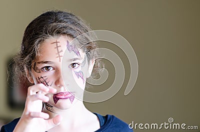 Little girl wears scary halloween makeup Stock Photo