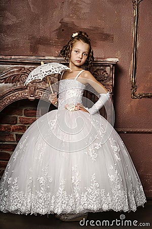 Little girl in wedding dress Stock Photo