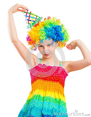 Little girl in wig and birthday hat Stock Photo