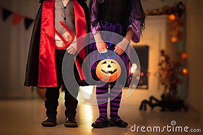 Kids in witch costume on Halloween trick or treat Stock Photo