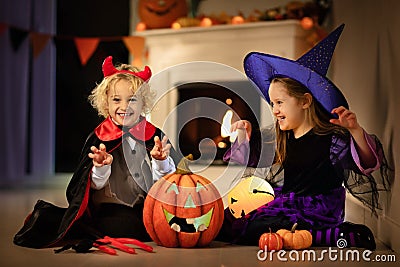 Kids in witch costume on Halloween trick or treat Stock Photo