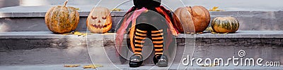 little girl in witch costume celebrate Halloween outdoor and have fun Stock Photo