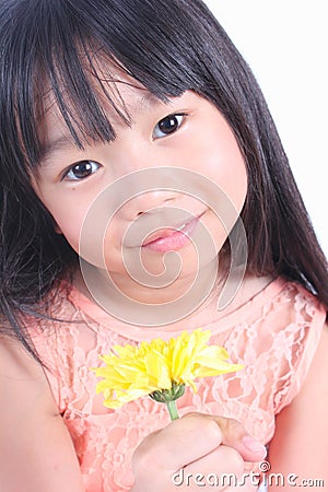 Little girl with yellow flower Stock Photo