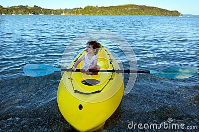 Little girl on a yellow Kayak Stock Photo