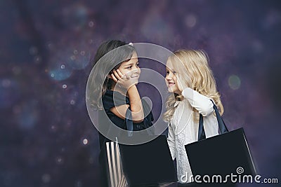 Little girls child fashion with paper bags on a background with Stock Photo