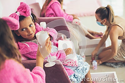 Little girls having part in spa center. Stock Photo