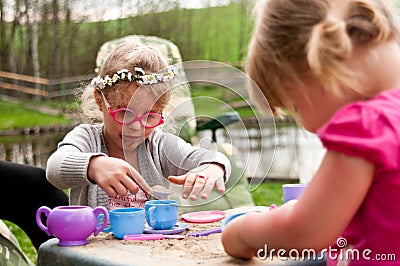 Little girls playing outdoors Stock Photo