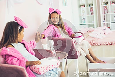 Little girls in spa center having treatment manicure and pedicure Stock Photo