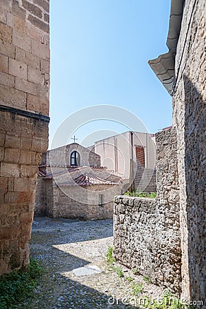 Little Greek Orthodox Church surrounded by residential dwellings in old town. Rhodes, Old Town, Island of Rhodes, Greece, Europe Editorial Stock Photo