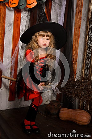 little halloween witch girl flying on broom Stock Photo