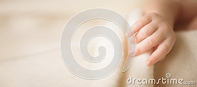 Little hand of newborn baby. Mom and her child. Maternity, family, care and birth concept. Copy space for your text Stock Photo