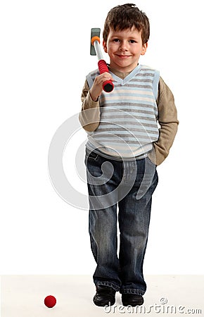 Little happy boy plays mini golf Stock Photo