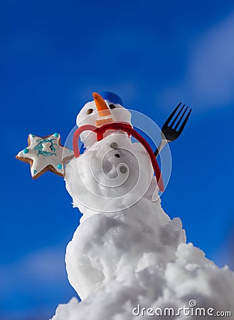 Little happy christmas snowman with cookie star outdoor. Winter season. Stock Photo