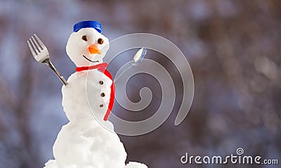 Little happy christmas snowman with fork outdoor. Winter season. Stock Photo