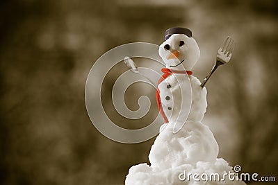 Little happy christmas snowman with fork outdoor. Winter season. Stock Photo