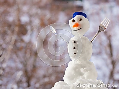 Little happy christmas snowman with fork outdoor. Winter season. Stock Photo