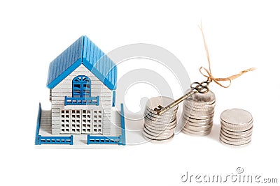 Little house toy and money isolated on a white background. Golden key, a symbol of success, business and wealth. getting the long Stock Photo