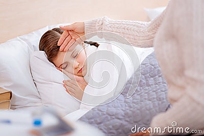 Little ill child sleeping peacefully in her bed Stock Photo