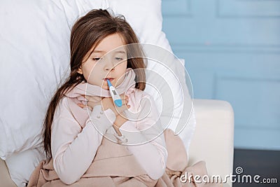 Little ill girl measuring temperature Stock Photo