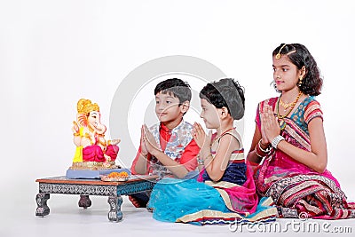 Little Indian children with lord ganesha and praying , Indian ganesh festival Stock Photo