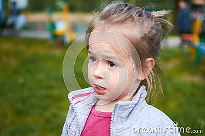 Little irritated child girl showing frustration and disagreement Stock Photo