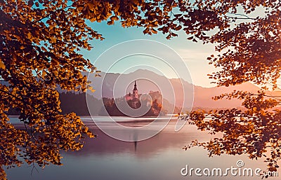 Little Island with Catholic Church in Bled Lake, Slovenia at Sunrise Stock Photo