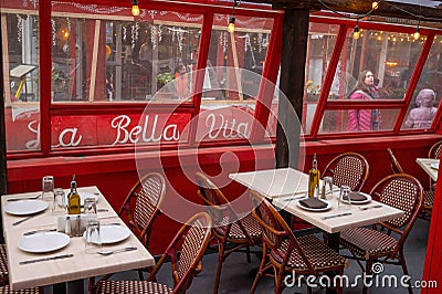 Outdoor restaurant covered seating area Little Italy NYC tables chairs Editorial Stock Photo