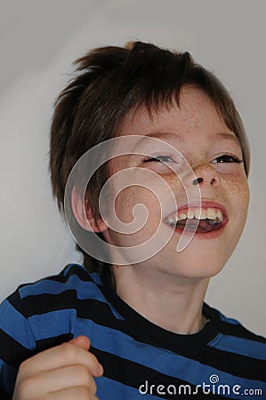 Little joyfully excited boy can hardly believe his luck Stock Photo