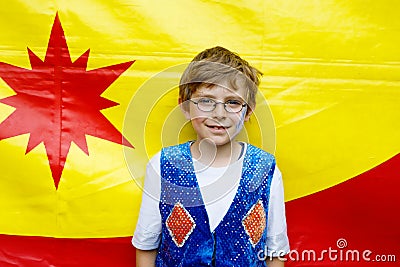 Little kid boy in eye glasses in magician costume. Happy child making circus as school project Stock Photo