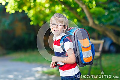 Little kid boy with school satchel on first day to school Stock Photo