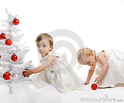 Little kid with a christmas tree Stock Photo