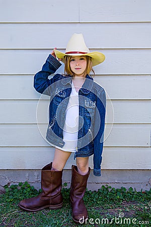 Little kid girl pretending to be a cowboy Stock Photo